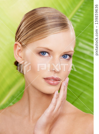 Woman, portrait and cosmetic beauty with leaf background for organic wellness for healthy skin, treatment or makeup. Female person, face and hand for fresh dermatology or natural, studio or mockup Woman, portrait and cosmetic beauty with leaf background for organic wellness for healthy skin, treatment or makeup. Female person, face and hand for fresh dermatology or natural, studio or mockup 139859636