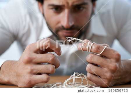 String, thread and man with eye of needle for stitching, sewing and needlework in fashion industry. Struggle, concentration and hands of person with tools for material, textile and tailor business String, thread and man with eye of needle for stitching, sewing and needlework in fashion industry. Struggle, concentration and hands of person with tools for material, textile and tailor business 139859723