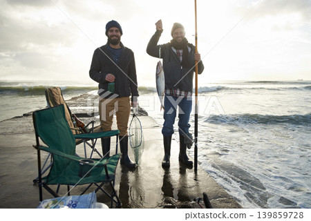 Happy, portrait and men fishing at ocean with pride for tuna catch on pier at sunset. Fisherman, friends and smile holding fish and rod in hand on holiday, adventure or vacation in nature at sea Happy, portrait and men fishing at ocean with pride for tuna catch on pier at sunset. Fisherman, friends and smile holding fish and rod in hand on holiday, adventure or vacation in nature at sea 139859728