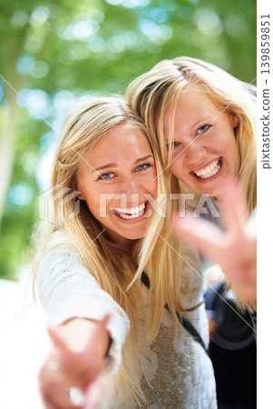 Peace, hands and women portrait in a park for fun, adventure or bonding outdoor together. V, sign or face of friends in a forest with freedom, travel and journey, excited and enjoying weekend reunion 139859851