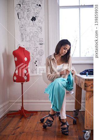 Woman, seamstress and fashion sewing in studio for small business, workshop and fabric for clothes. Designer, startup and production for boutique, create and thread with craft for retail store Woman, seamstress and fashion sewing in studio for small business, workshop and fabric for clothes. Designer, startup and production for boutique, create and thread with craft for retail store 139859938