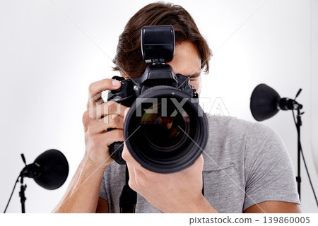 Man, camera lens and photography with technology in studio, press or media for news on white background. Photographer, photo journalist and creative with paparazzi, equipment or gadget with closeup Man, camera lens and photography with technology in studio, press or media for news on white background. Photographer, photo journalist and creative with paparazzi, equipment or gadget with closeup 139860005
