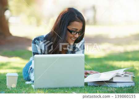Laptop, grass or happy woman in park with books for learning knowledge, information or education. Smile, textbooks or female student in nature for studying history or typing online on college campus Laptop, grass or happy woman in park with books for learning knowledge, information or education. Smile, textbooks or female student in nature for studying history or typing online on college campus 139860155
