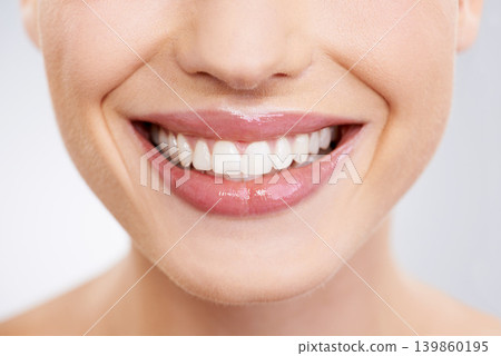 Beauty, mouth and teeth with woman closeup in studio on gray background for dental care or oral hygiene. Skincare, smile and orthodontics with happy young model at spa or dentist for natural wellness Beauty, mouth and teeth with woman closeup in studio on gray background for dental care or oral hygiene. Skincare, smile and orthodontics with happy young model at spa or dentist for natural wellness 139860195