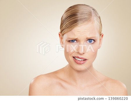 Portrait, doubt and space for beauty with woman in studio on beige background to question wellness. Confused, skincare and funny face for problem on mockup with young model at spa for dermatology Portrait, doubt and space for beauty with woman in studio on beige background to question wellness. Confused, skincare and funny face for problem on mockup with young model at spa for dermatology 139860220