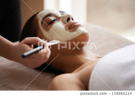 Beauty, relax and woman with face mask at spa for glow, wellness and skincare routine with self care. Cosmetic, pamper and female person with natural clay facial dermatology treatment at salon. Beauty, relax and woman with face mask at spa for glow, wellness and skincare routine with self care. Cosmetic, pamper and female person with natural clay facial dermatology treatment at salon. 139860224