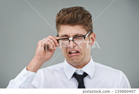 Businessman, glasses and disgust in studio for optical healthcare, omg and overwhelmed on gray backdrop. Male person, eyewear and dislike the frame choice, optometry and lens for vision support Businessman, glasses and disgust in studio for optical healthcare, omg and overwhelmed on gray backdrop. Male person, eyewear and dislike the frame choice, optometry and lens for vision support 139860407