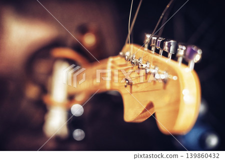 Closeup, guitar and music in studio for band, rehearsal and session to perform on stage, song and entertainment. Artist, recording and album for live at concert, loud with audio for audience. Closeup, guitar and music in studio for band, rehearsal and session to perform on stage, song and entertainment. Artist, recording and album for live at concert, loud with audio for audience. 139860432