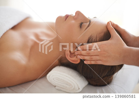 Hands, head massage and woman at salon to relax, wellness and calm at luxury resort for therapy with masseuse for health. Closeup, face and person at spa for facial treatment, skincare and beauty 139860581