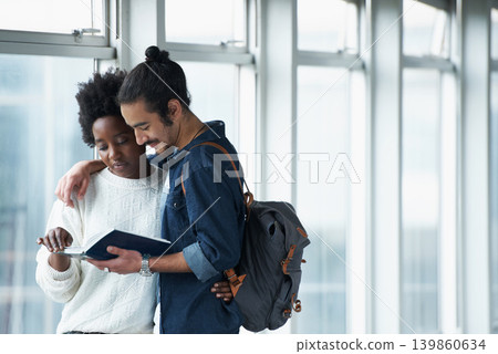 Couple, university and students with a book, hug and conversation for project and teamwork. College, man and woman with ideas or brainstorming with planning and education with embrace or knowledge Couple, university and students with a book, hug and conversation for project and teamwork. College, man and woman with ideas or brainstorming with planning and education with embrace or knowledge 139860634