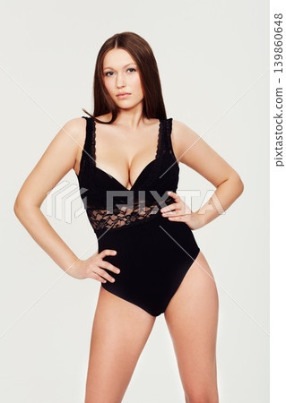 Body, beauty or portrait of woman with lingerie in studio for wellness, care or glowing skin on white background. Bodysuit, underwear or female model with confidence, attitude or classy style choice Body, beauty or portrait of woman with lingerie in studio for wellness, care or glowing skin on white background. Bodysuit, underwear or female model with confidence, attitude or classy style choice 139860648