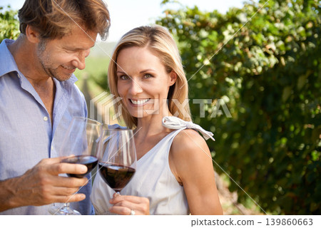 Woman, portrait and man in vineyard for wine tasting, nature and smile for honeymoon trip for alcohol. People, happiness and standing in farm for agriculture with fruit and love for marriage Woman, portrait and man in vineyard for wine tasting, nature and smile for honeymoon trip for alcohol. People, happiness and standing in farm for agriculture with fruit and love for marriage 139860663