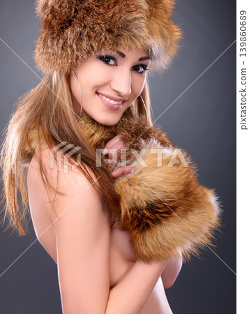 Woman, portrait and hat with fur in studio for fashion, aesthetic and naked with happiness or confidence. Model, person and face with winter style, smile and pride or shirtless on black background 139860689