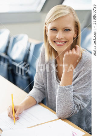 Portrait, university or happy woman in classroom for knowledge, school development or notes. Scholarship, education or proud student with paper or smile for studying or learning in college campus Portrait, university or happy woman in classroom for knowledge, school development or notes. Scholarship, education or proud student with paper or smile for studying or learning in college campus 139860759