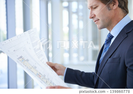 Engineering blueprint, architecture and man in office with papers for planning, building project and property. Real estate, contractor and person with document, idea or drawing for floor plan 139860778