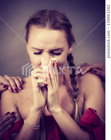 Friends helping woman during fever. Friends helping woman during fever. 139861082