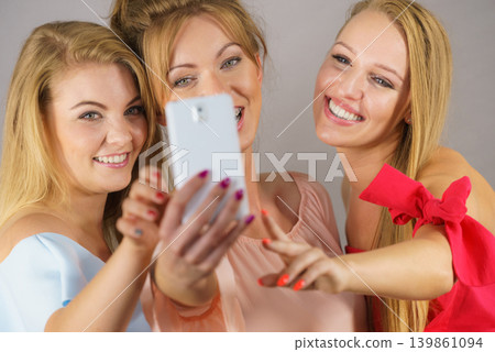 Fashionable women taking selfie 139861094