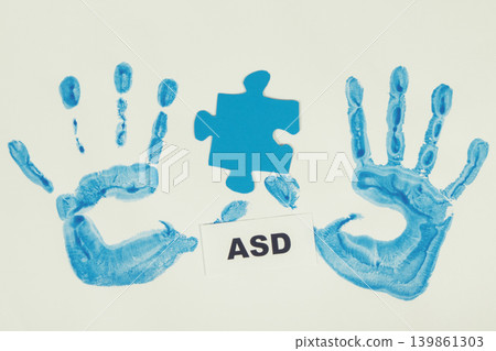 Kid handprint made of paint and inscription ASD. Autism Spectrum Disorder Kid handprint made of paint and inscription ASD. Autism Spectrum Disorder 139861303