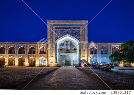 Night view of the Muhammad Rahim Khan Madrasa, a UNESCO World Heritage Site in Khiva, Uzbekistan. Night view of the Muhammad Rahim Khan Madrasa, a UNESCO World Heritage Site in Khiva, Uzbekistan. 139861317