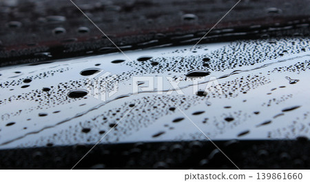 Glossy Surface Of Black Car Hood Covered Water Repellent Liquid Agent Glossy Surface Of Black Car Hood Covered Water Repellent Liquid Agent 139861660