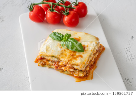 Overhead Lasagna With Golden Mozzarella Basil And Fresh Cherry Tomatoes 139861737