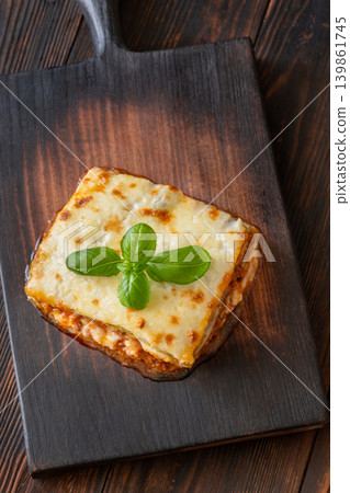 Traditional Lasagna Bolognese Slice Served On Dark Rustic Wooden Board Traditional Lasagna Bolognese Slice Served On Dark Rustic Wooden Board 139861745