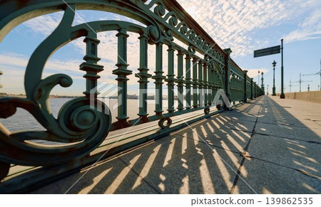 antique wrought iron railings of the Trinity Bridge, Troitsky Bridge on a spring morning antique wrought iron railings of the Trinity Bridge, Troitsky Bridge on a spring morning 139862535