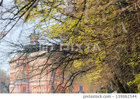 Engineering castle across the Moika River with a beautiful embankment on a sunny May morning, Russia, St.Petersburg Engineering castle across the Moika River with a beautiful embankment on a sunny May morning, Russia, St.Petersburg 139862544