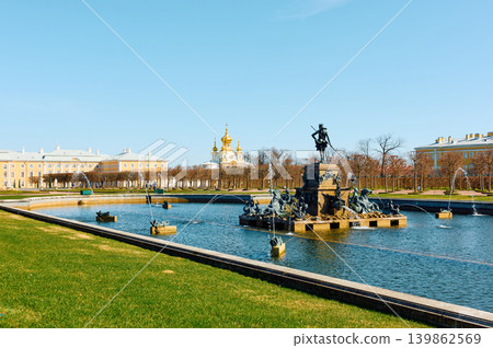 fountains of the upper garden of Peterhof Palace at clear sunny day, preparations for the opening of the fountain season, gold covered fountains of the upper garden of Peterhof Palace at clear sunny day, preparations for the opening of the fountain season, gold covered 139862569
