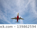 A huge passenger plane is landing in airport of Phuket, Thailand, a bottom view  139862594