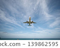 A huge passenger plane is landing in airport of Phuket, Thailand, a bottom view  139862595