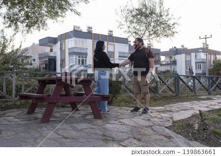 Couple Meeting Outdoors in Green Park. Couple Meeting Outdoors in Green Park. 139863661