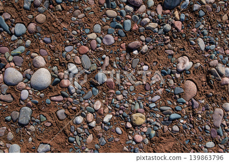 Small stones on dried riverbed Small stones on dried riverbed 139863796