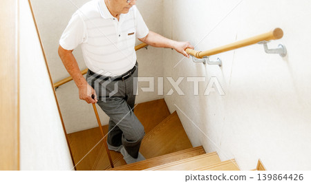Senior man climbing the stairs Senior man climbing the stairs 139864426