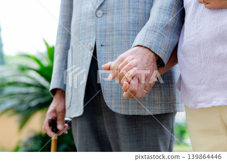 Senior couple holding hands Senior couple holding hands 139864446