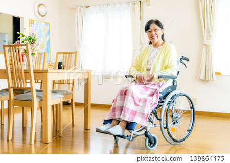 Senior woman sitting in a wheelchair Senior woman sitting in a wheelchair 139864475