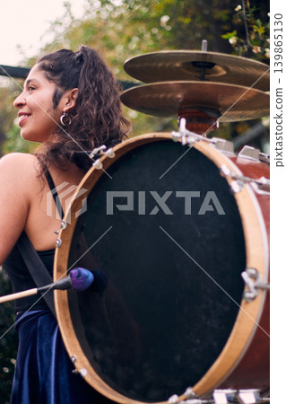 Detail of a musical instrument, bass drum and cymbals belonging to a chinchinera, a female street musician who dances and plays her drum in the streets. Chilean heritage, Chilean culture Detail of a musical instrument, bass drum and cymbals belonging to a chinchinera, a female street musician who dances and plays her drum in the streets. Chilean heritage, Chilean culture 139865130