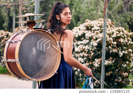 Detail of a musical instrument, bass drum and cymbals belonging to a chinchinera, a female street musician who dances and plays her drum in the streets. Chilean heritage, Chilean culture 139865135