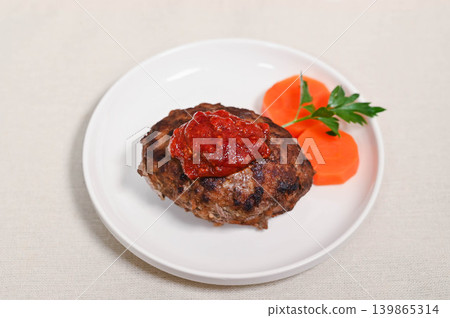 Homemade hamburger steak and glazed carrots Homemade hamburger steak and glazed carrots 139865314