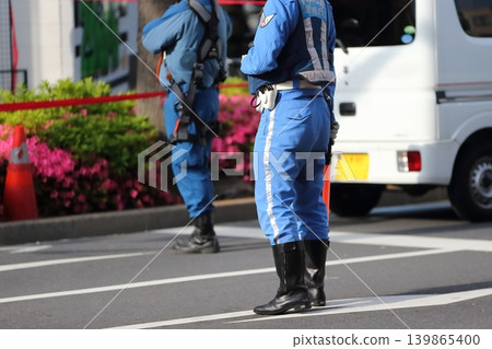 Police officers directing traffic (traffic police unit) Police officers directing traffic (traffic police unit) 139865400