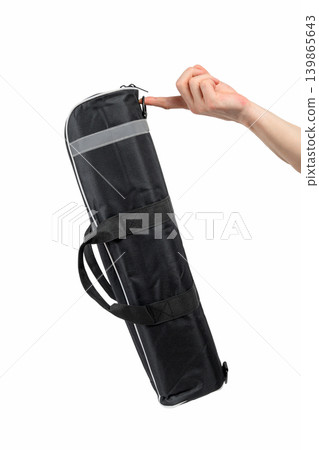 hand finger holds tripod case by loop isolated on white background hand finger holds tripod case by loop isolated on white background 139865643