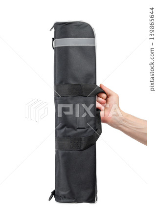 hand firmly grips handle of photo equipment bag isolated on white background hand firmly grips handle of photo equipment bag isolated on white background 139865644