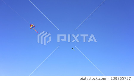 Colorful Kites Flying Across Clear Blue Sky Colorful Kites Flying Across Clear Blue Sky 139865737