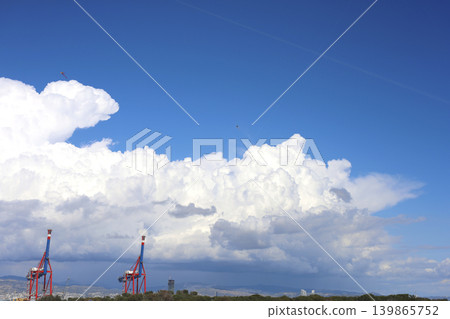 Dramatic Blue Sky Over Industrial Port Cranes 139865752