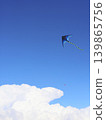 Kite Flying Over Bright Blue Summer Sky 139865756