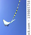 Bright Kite Soaring High Against Blue Sky 139865758