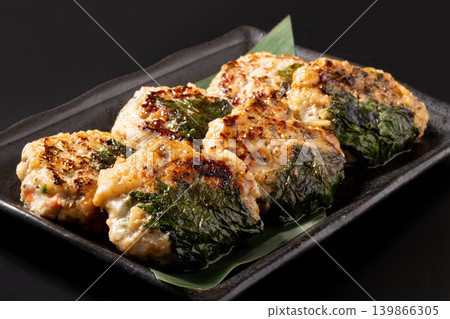 Chicken and pork meatballs with cartilage wrapped in perilla leaf. Chicken and pork meatballs with cartilage wrapped in perilla leaf. 139866305