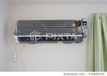 Air conditioner with cover removed (being cleaned) Air conditioner with cover removed (being cleaned) 139866329