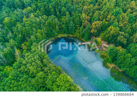 Aerial view of Blue Lake with its crystal clear turquoise waters and a small wooden pier 139866684