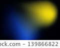 Abstract image featuring soft blue and yellow light spots against dark background, creating moody and artistic atmosphere 139866822